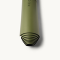 Emerald Neosava MineralFlex luxury non-slip yoga mat with refined minimalist design for stable yoga flow, pilates training, and mindful wellness routines.
