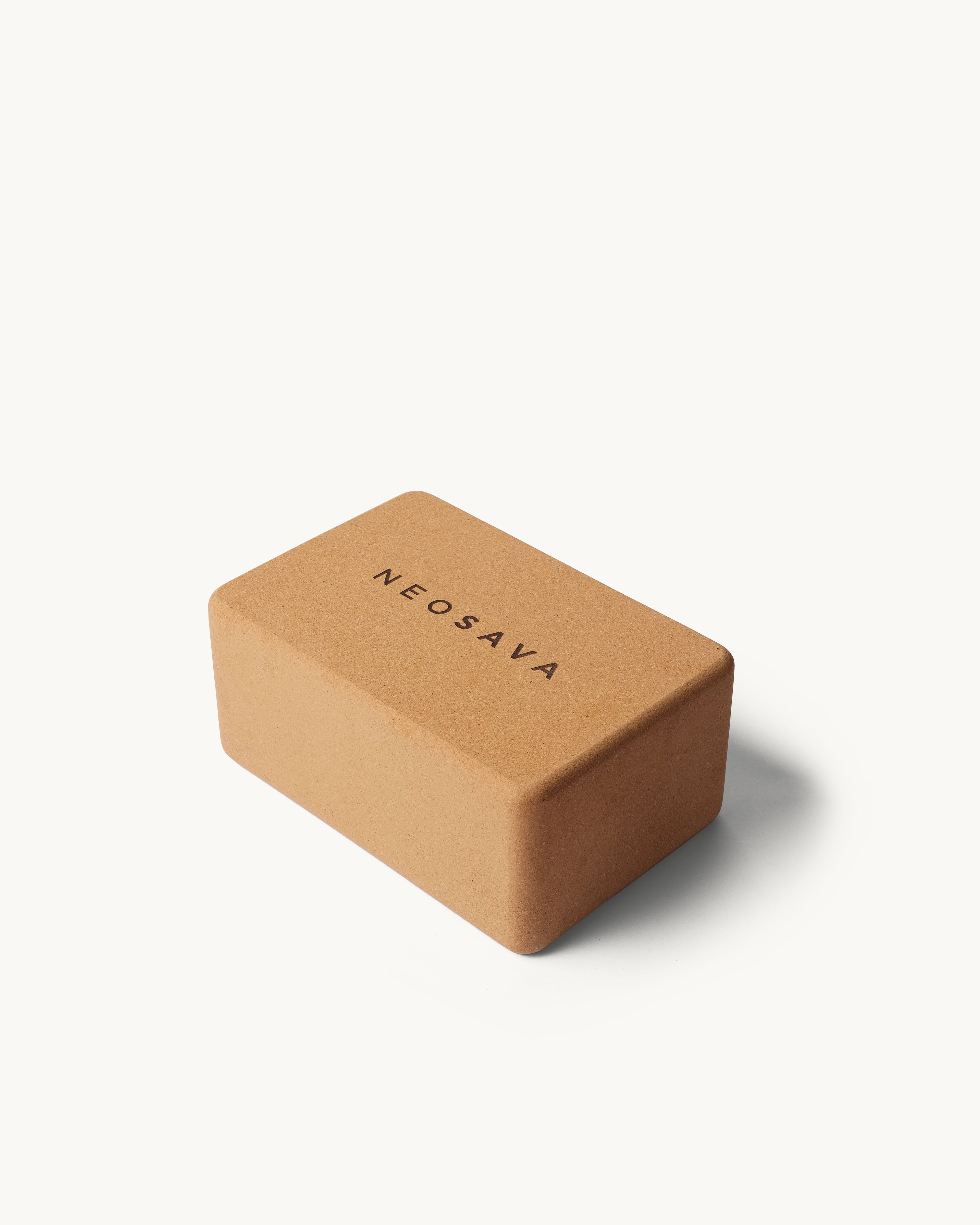 Neosava minimalist yoga block for studio practice, home yoga, pilates, stretching, supported poses, balance training, flexibility, posture alignment, meditation setup, and elevated wellness routines.