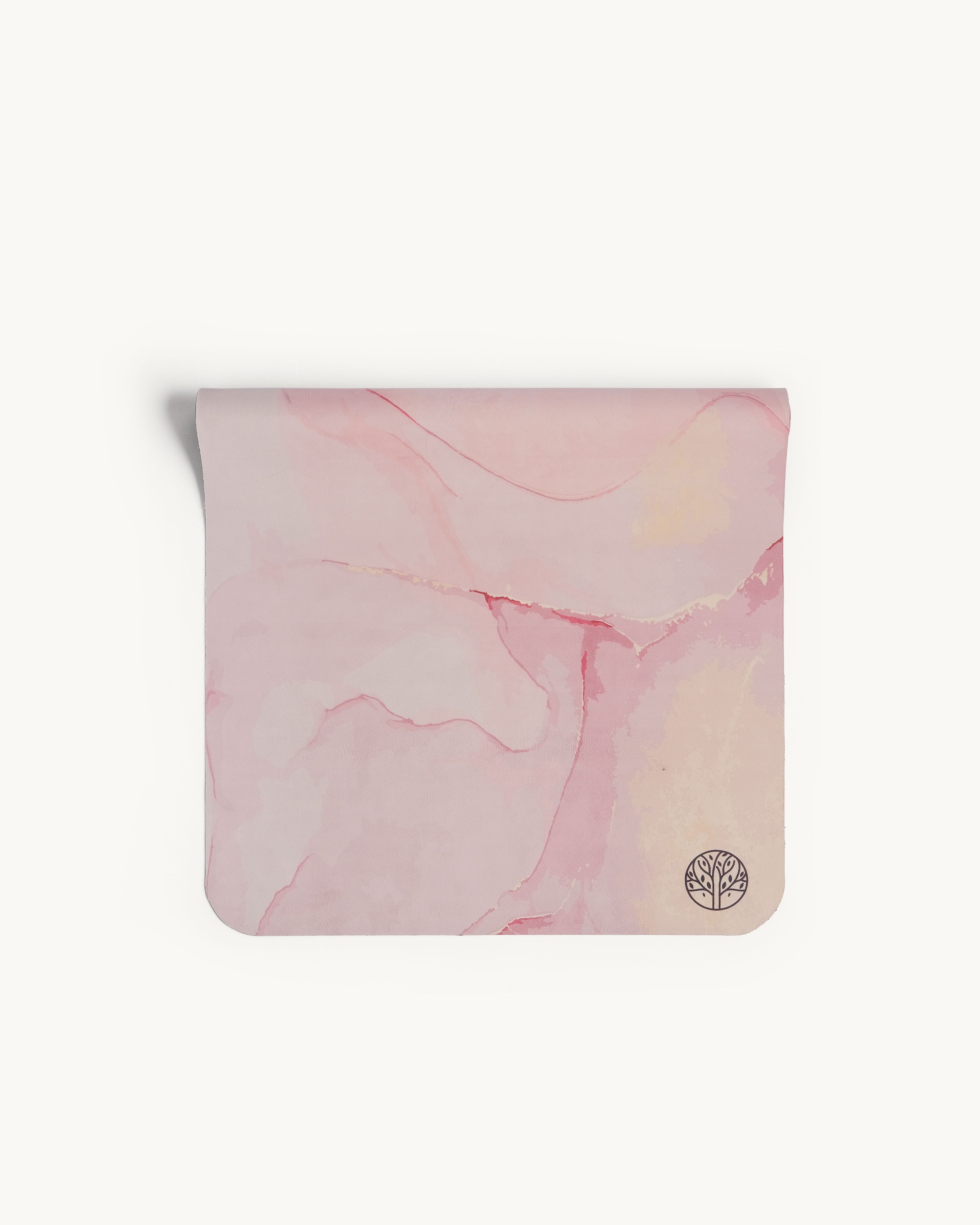 Neosava Travelmat Strawberry Quartz premium travel yoga mat with soft blush marble design, created for yoga, pilates, stretching, and elegant mindful movement on the go.